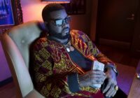 GTA 6 pre-orders: Boobie Ike holding a stack of cash in his Vice City office