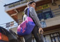 GTA 6 region lock: Lucia Caminos outside a check-cashing store in Leonida